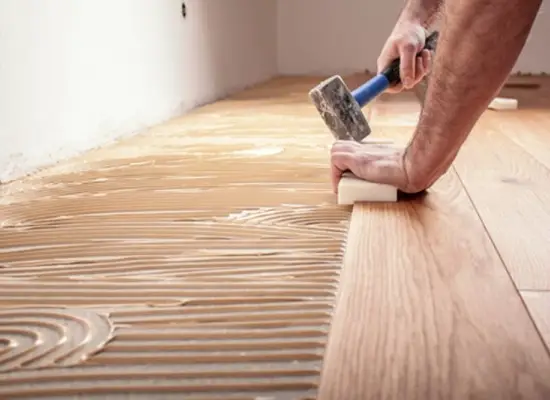 Pose de parquet massif collé en plein sur chape par IMMOPRESTA